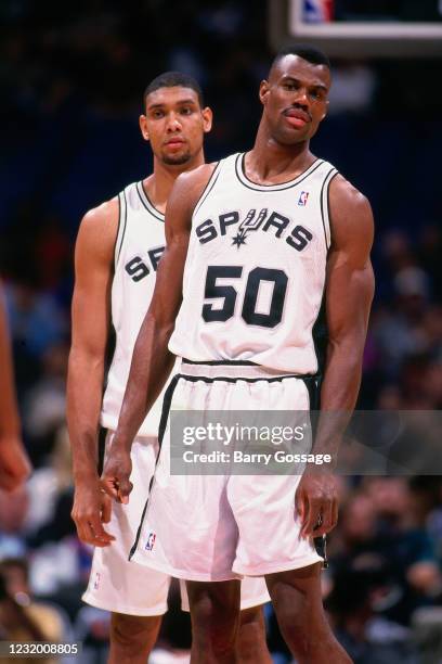 David Robinson and Tim Duncan of the San Antonio Spurs against the New York Knicks during a game on December 02, 1997 at the Alamodome in San...