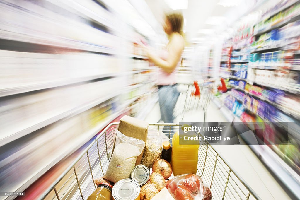 Shopping cart in store with motion blur