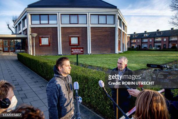 Churchgoer and the auxiliary clerk of the Mieraskerk speak to the press outside the Mieraskerk , after the church was damaged by a small explosion,...