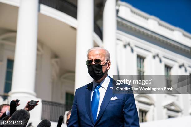 March 26, 2021: President Joe Biden speaks with the press before departing on board Marine One on the south lawn of the White House on March 26, 2021.