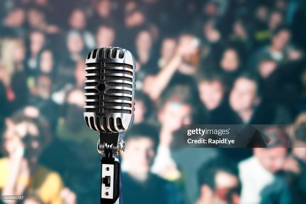 Retro microphone in front of audience