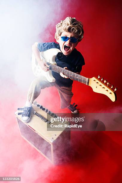 rock star kid - voice amplifier stock pictures, royalty-free photos & images