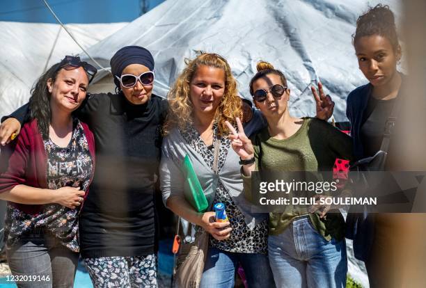 Group of women, reportedly the wives of suspected Islamic State group fighters, pose on March 28, 2021 for a picture at Camp Al-Roj, where relatives...