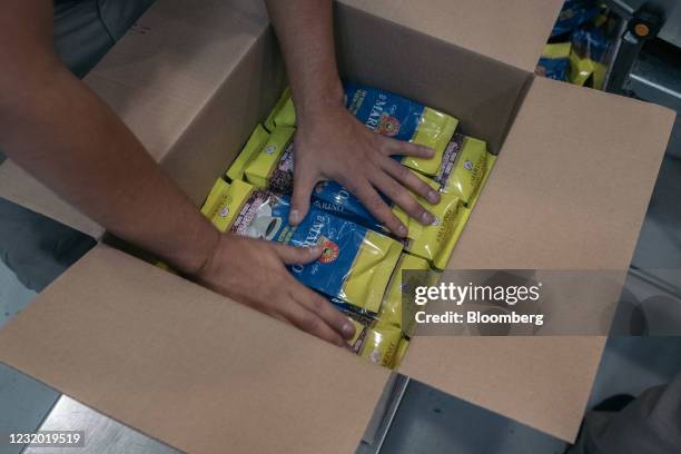 Worker packages coffee bags at the El Marino factory in Mazatlan, Sinaloa state, Mexico, on Tuesday, March 23, 2021. Coffee production in Mexico has...