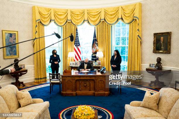 Flanked by Vice President Kamala Harris and Administrator of the Small Business Administration Isabella Casillas Guzman , U.S. President Joe Biden...