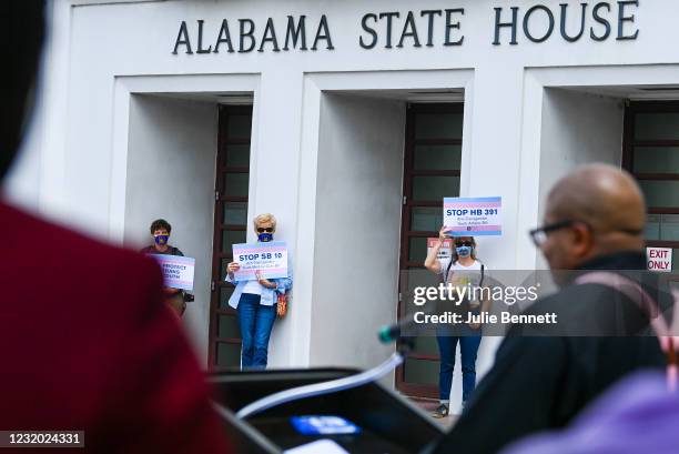 Opponents of several bills targeting transgender youth attend a rally at the Alabama State House to draw attention to anti-transgender legislation...