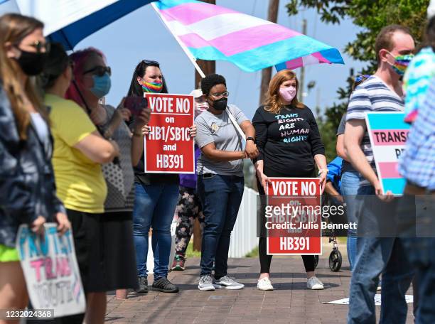 Opponents of several bills targeting transgender youth attend a rally at the Alabama State House to draw attention to anti-transgender legislation...