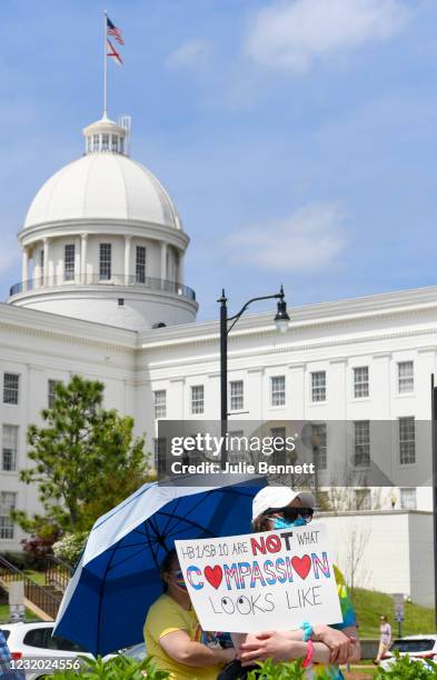 Opponents of several bills targeting transgender youth attend a rally at the Alabama State House to draw attention to anti-transgender legislation...