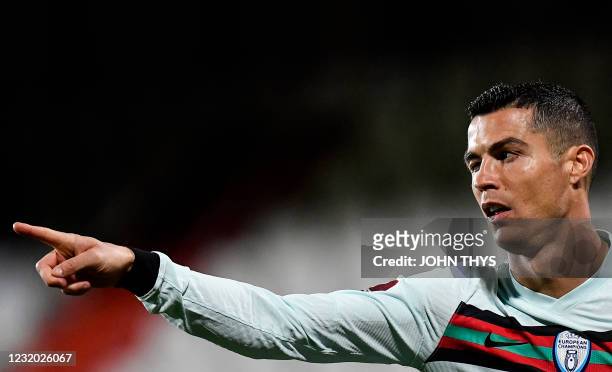 Portugal's forward Cristiano Ronaldo celebrates after scoring a goal during the FIFA World Cup Qatar 2022 qualification Group A football match...