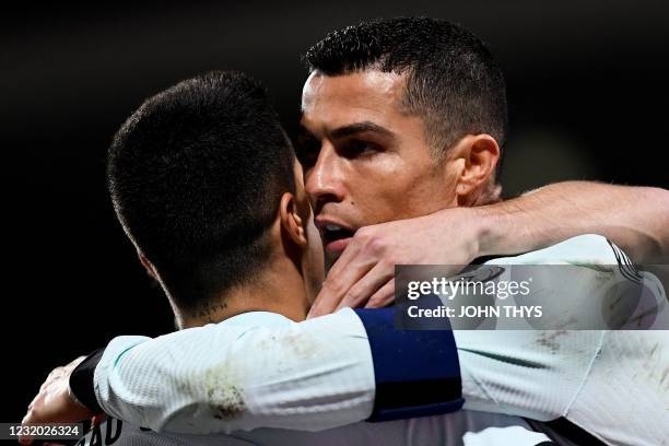 Portugal's forward Cristiano Ronaldo celebrates with teammates after scoring a goal during the FIFA World Cup Qatar 2022 qualification Group A...