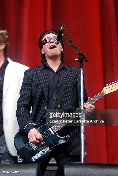 Guitarist Andy Taylor from the band Duran Duran performing on stage during their concert at Aussie Stadium on December 13, 2003 in Sydney, Australia.