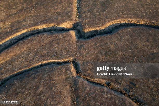 In an aerial view from a drone, offset creeks, split by the movement of the Pacific and North American tectonic plates in opposite directions, are...