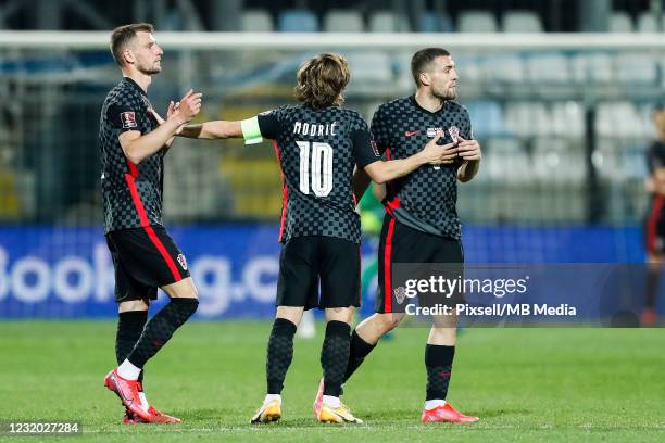 Luka Modric, Mateo Kovacic and Borna Barisic of Croatia celebrate a goal during the FIFA World Cup 2022 Qatar qualifying match between Croatia and...