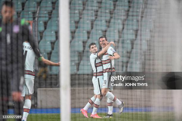 Portugal's midfielder Joao Palhinha celebrates with teammates after scoring a goal during the FIFA World Cup Qatar 2022 qualification Group A...