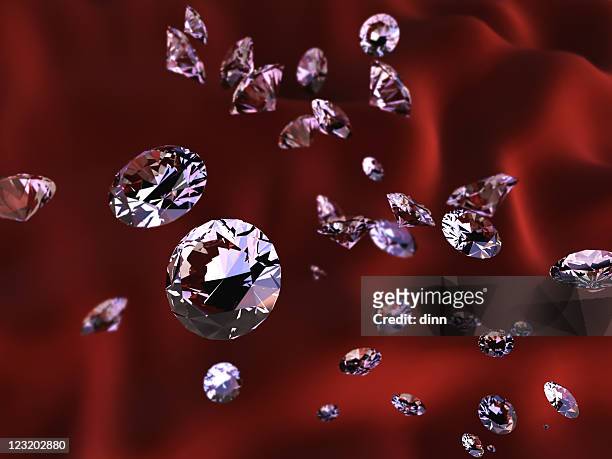 diamonds on red silk - jewellery background stock pictures, royalty-free photos & images