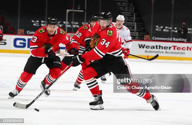 Carl Soderberg of the Chicago Blackhawks approaches the puck in the third period against the Carolina Hurricanes at the United Center on March 30,...