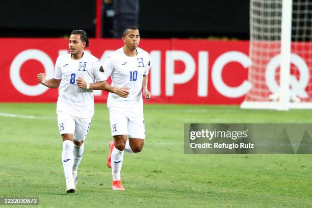 Edwin Rodríguez of Honduras celebrates with teammate after scoring the first goal of his team during the final match between Honduras and Mexico as...