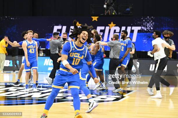 Tyger Campbell of the UCLA Bruins celebrates their win over the Michigan Wolverines in the Elite Eight round of the 2021 NCAA Division I Men's...