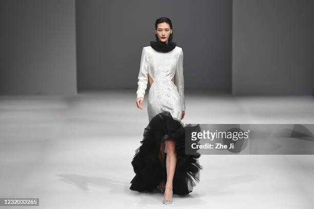 Model walks the runway during the LOORA PWD collection show by Loora on day eight of China Fashion Week A/W 2021/2022 at 751D.PARK on March 31, 2021...