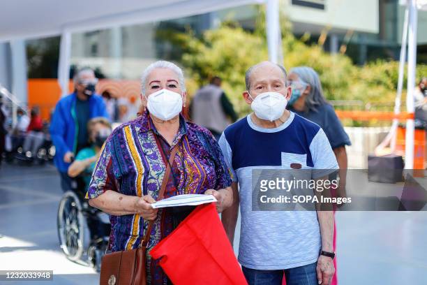 Elderly people pose for a photo after receiving the vaccine against Covid-19. The vaccination day against Covid-19 for the elderly people begun at...
