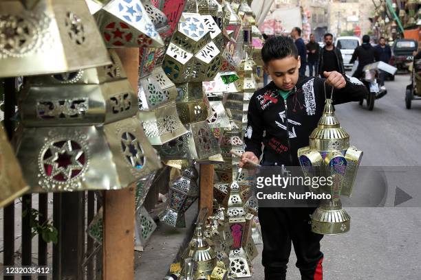 People walking at the Khayameya Street in old Cairo, Egypt, 30 March 2021.which is famous for selling Ramadan lanterns ahead of Islam's holy fasting...