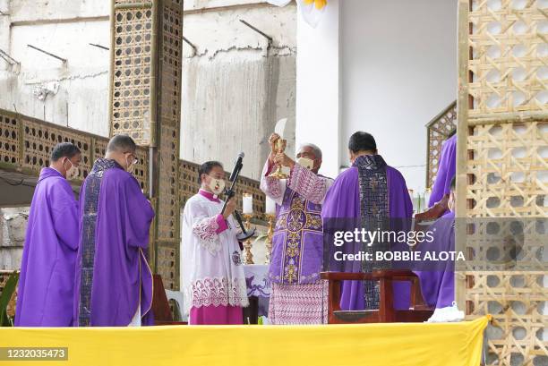 Roman Catholic Bishop Precioso Cantillas celebrates mass along with other priests in Limasawa island, southern Leyte province in the central...