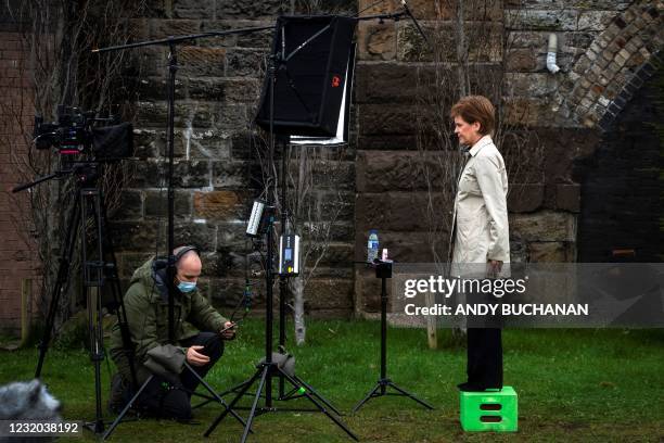 Scotland's First Minister and leader of the Scottish National Party , Nicola Sturgeon waits for the camera technician as she launches the SNP virtual...