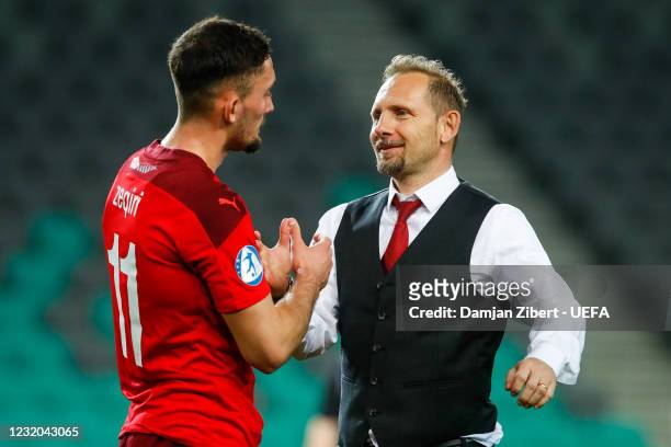 Andi Zeqiri of Switzerland is congratulated by Mauro Lustrinelli, Head coach of Switzerland after the UEFA Under-21 Championship 2021 Group Stage...