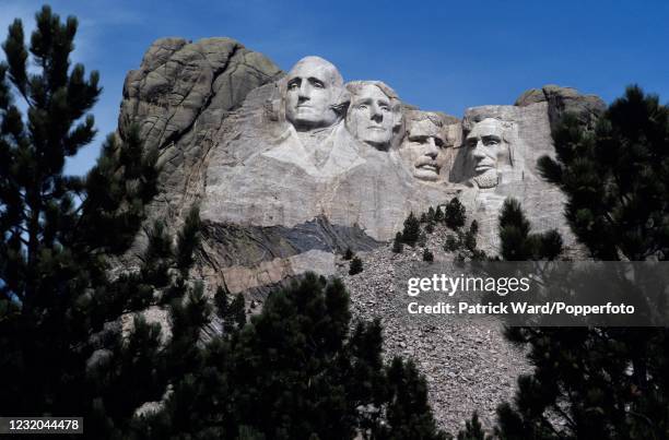 The sculptures of four American presidents, including, left to right, George Washington, Thomas Jefferson, Theodore Roosevelt and Abraham Lincoln, at...