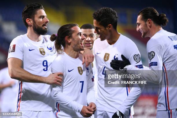 France's forward Antoine Griezmann celebrates with teammates after scoring a goal during the FIFA World Cup Qatar 2022 qualification Group D football...