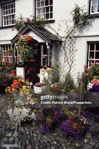 Flowers filling the garden of Hilltop House, the former home of children's author and conservationist Beatrix Potter, at Near Sawrey in the Lake...