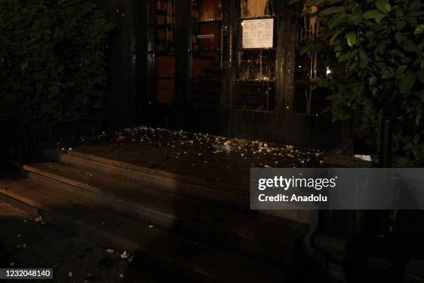 View of the entrance of the Rums Hotel after demonstrators throw eggs as they gather to protest against Russian journalist Vladimir Pozner and his...