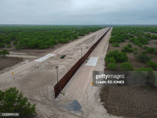 Photo taken on March 30, 2021 shows a general view of an unfinished section of a border wall that former US president Donald Trump tried to build...