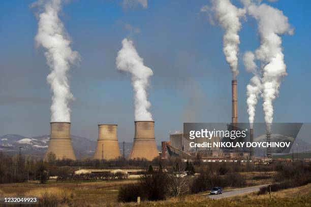 Picture taken on March 25, 2021 shows smoke and vapor billowing from the Bobov Dol Thermal Power Plant, near the village of Golemo Selo. - With its...
