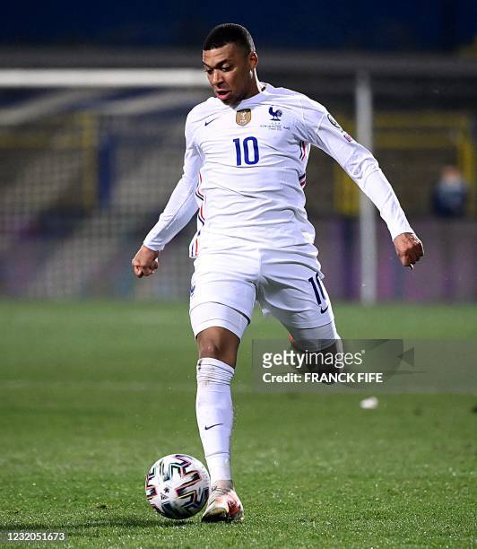 France's forward Kylian Mbappe plays the ball during the FIFA World Cup Qatar 2022 qualification Group D football match between Bosnia-Herzegovina...