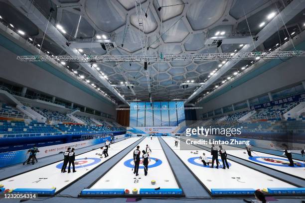 Chinese players compete in the Curling mixed group A at Water Cube on April 1, 2021 in Beijing, China. A "Meet in Beijing" ice test event for the...