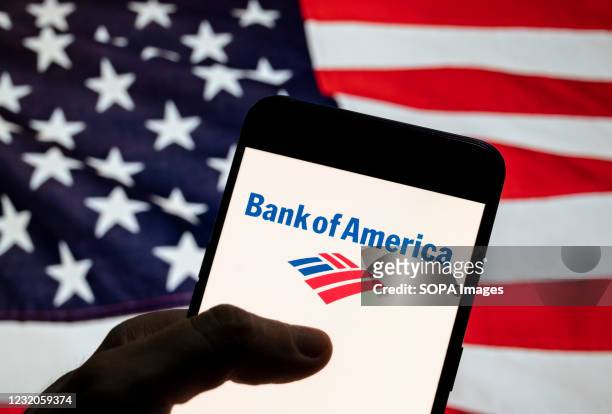 In this photo illustration the American multinational investment bank and financial services company, The Bank of America, logo is seen on an Android...