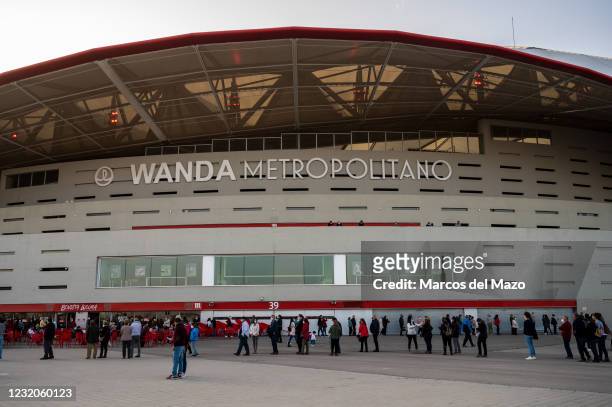 People queue in Wanda Metropolitan Stadium to receive the first dose of AstraZeneca vaccine against coronavirus during a mass vaccination for the...