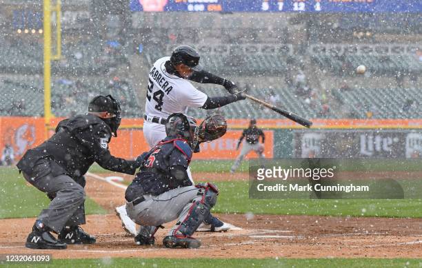 Miguel Cabrera of the Detroit Tigers hits a two-run home run in the first inning of the Opening Day game against the Cleveland Indians at Comerica...