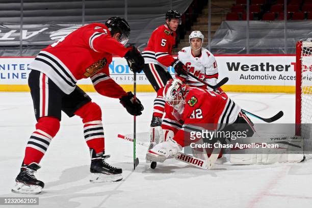 Kevin Lankinen of the Chicago Blackhawks makes a save in the second period against the Carolina Hurricanes at the United Center on April 01, 2021 in...