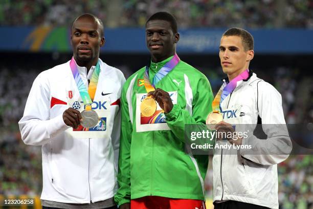 Silver medalist LaShawn Merritt of United States, gold medalist Kirani James of Grenada and and bronze medalist Kevin Borlee of Belgium celebrate on...