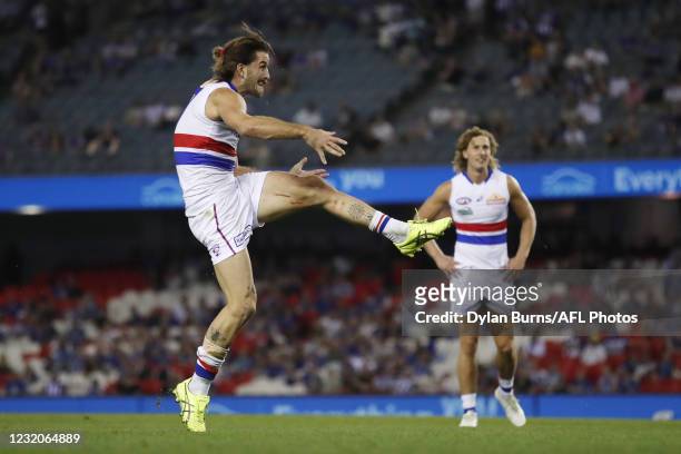 Josh Bruce of the Bulldogs kicks his 10th goal during the 2021 AFL Round 03 match between the North Melbourne Kangaroos and the Western Bulldogs at...