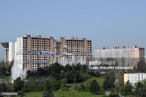 The housing building "Monmousseau" of the "ICF Habitat" is torn down through the use of pre-positioned explosives, in the popular neighbourhood of...