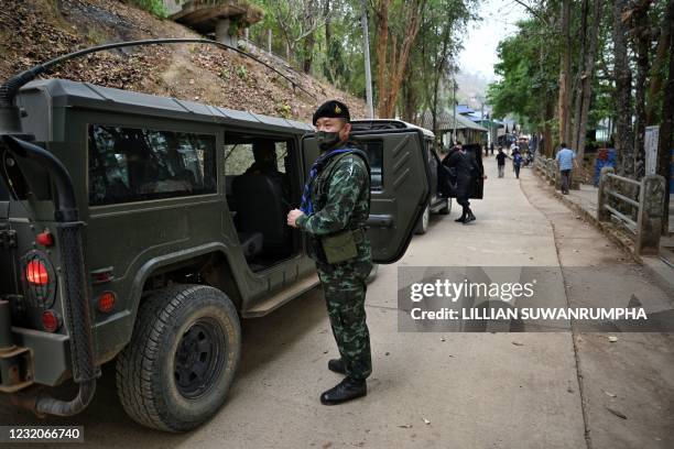 Thai army soldiers gather at a checkpoint in Mae Sam Laep town on the Thai side of the Salween river in Mae Hong Son province on April 2 across from...