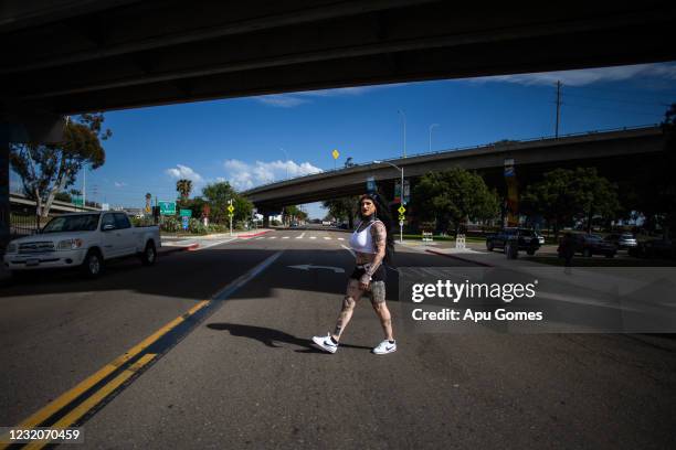 Diego Garijo's alter ego, Lola Pistola crosses a street at Barrio Logan on April 01, 2021 in San Diego, California. Born in Guanajuato, Mexico,...