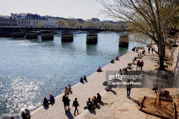 People enjoy the sun on the Quai de Seine in Paris, France, on April 2 after that the president Emmanuel Macron ordered a new nationwide lockdown...