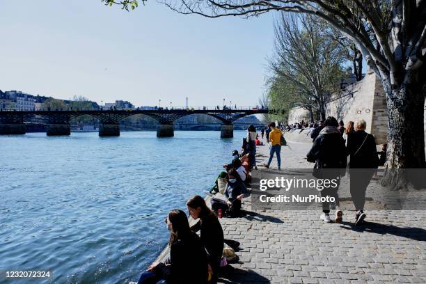 People enjoy the sun on the Quai de Seine in Paris, France, on April 2 after that the president Emmanuel Macron ordered a new nationwide lockdown...