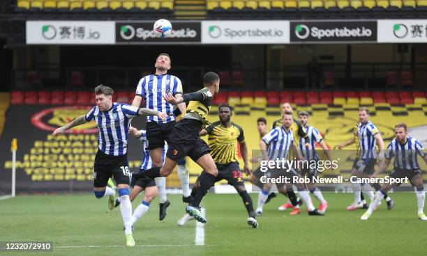 Sheffield Wednesday's Josh Windass and Sam Hutchinson challenge Watford's Joao Pedro for a cross during the Sky Bet Championship match between...