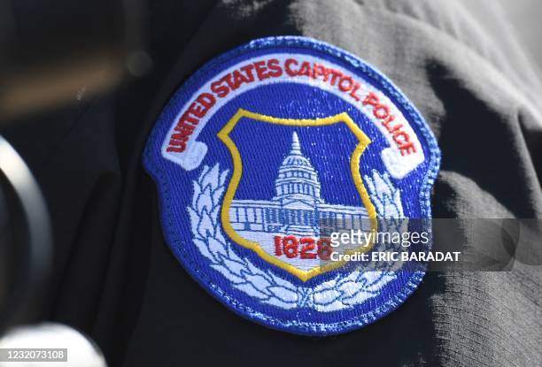 The badge of acting Chief of Capitol Police Yogananda Pittman is seen during a press conference near the US Capitol on April 2 after a vehicle drove...