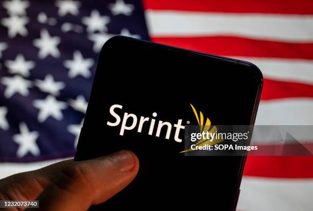 In this photo illustration the American telecommunications company provides wireless services internet service provider Sprint logo is seen on an...